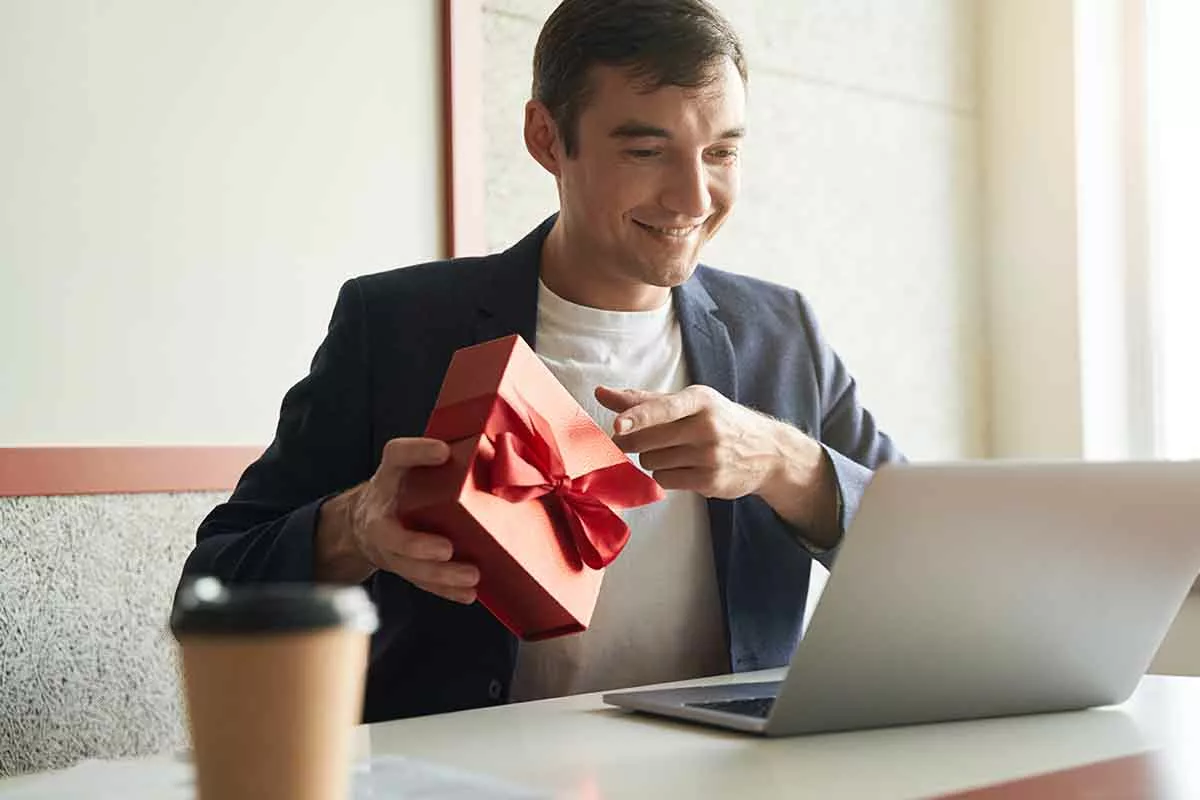 man receives a corporate gift at work